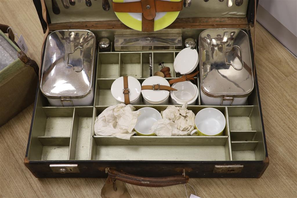 A vintage French picnic set and canvas picnic hamper